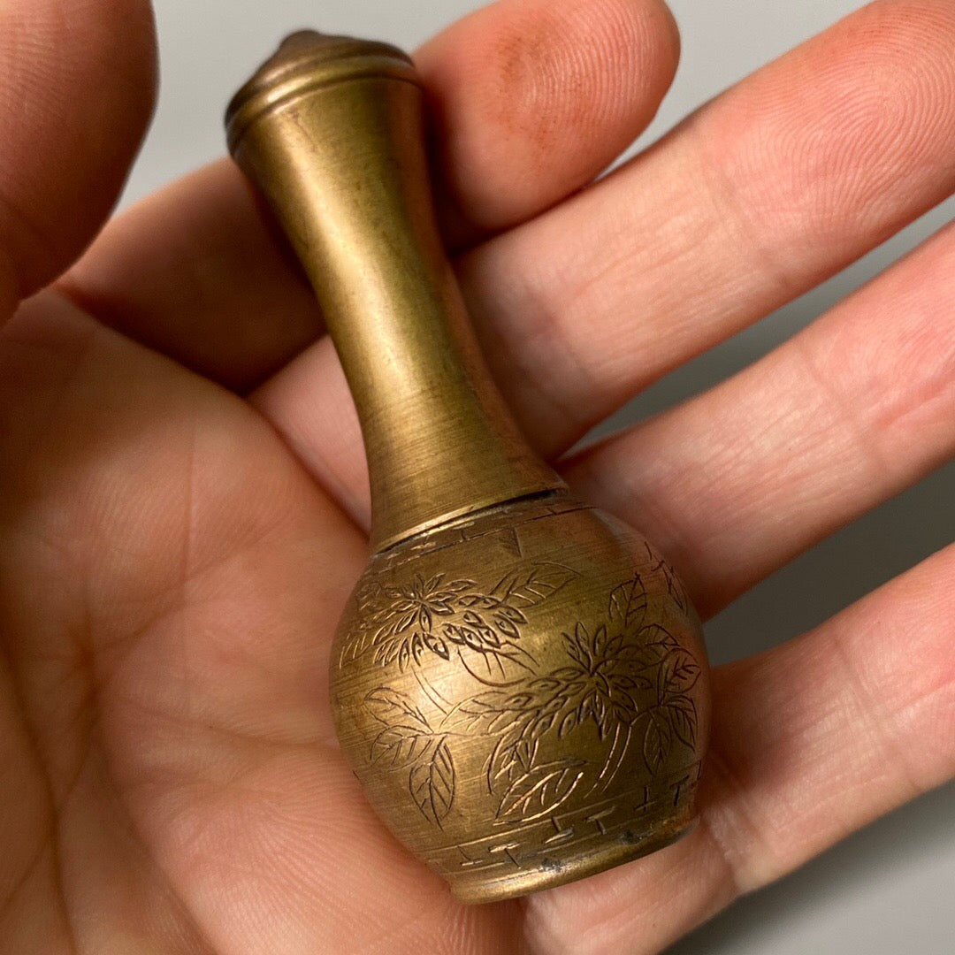 A set of carved Chinese antique brass snuff bottles from spring, summer, autumn, and winter