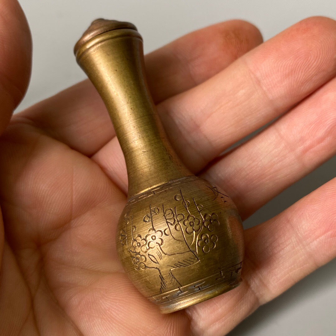 A set of carved Chinese antique brass snuff bottles from spring, summer, autumn, and winter