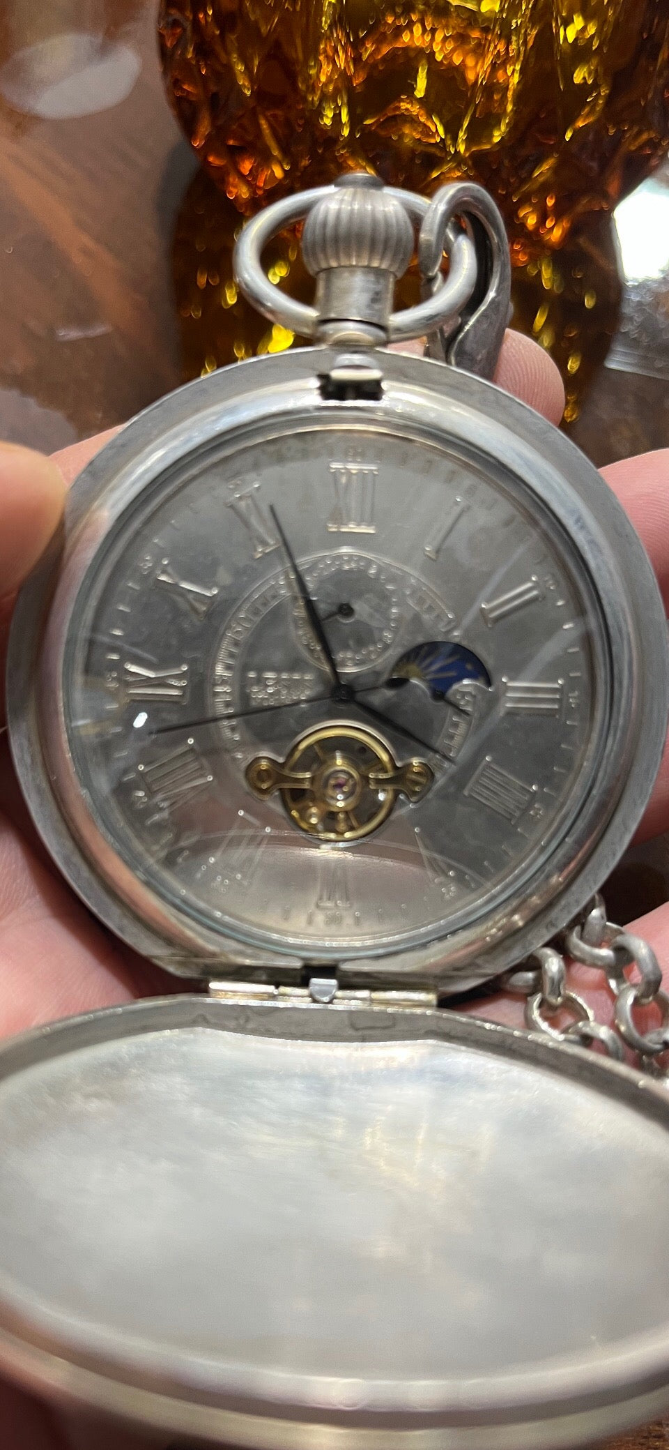 Chinese antique double opening pocket watch with sun, moon, and stars