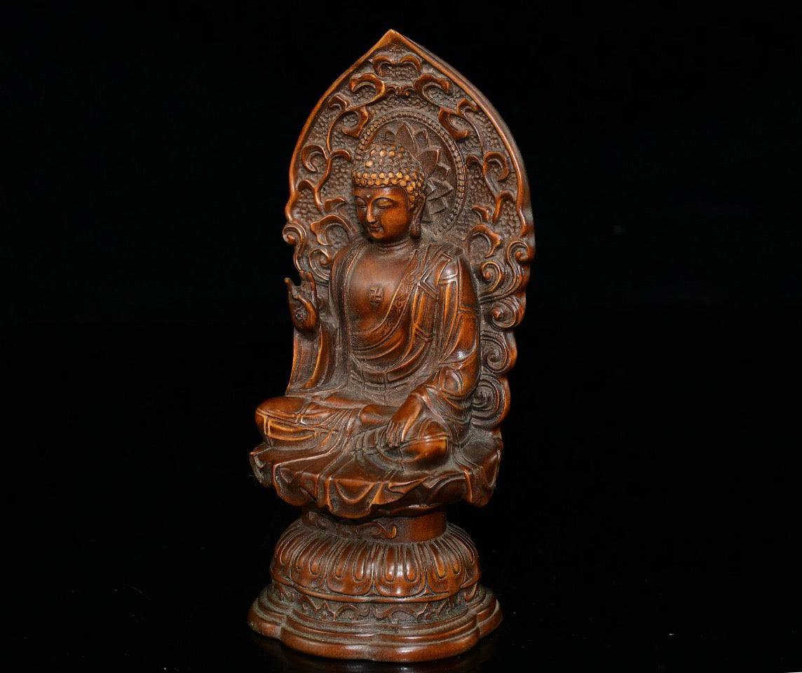 Small leaved boxwood with north facing Buddha ornaments