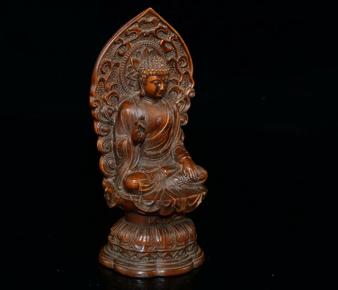 Small leaved boxwood with north facing Buddha ornaments