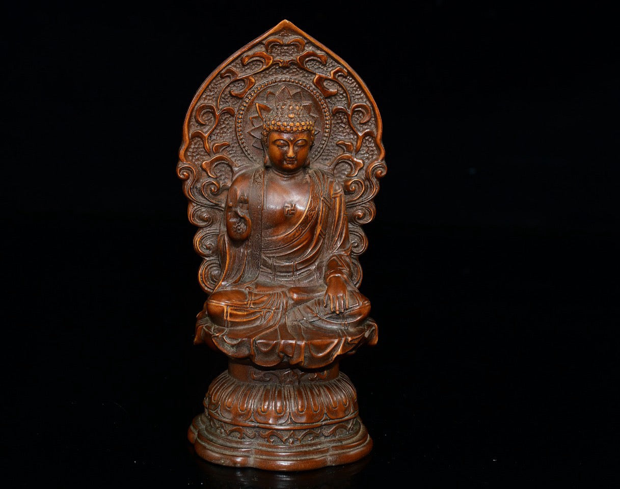 Small leaved boxwood with north facing Buddha ornaments