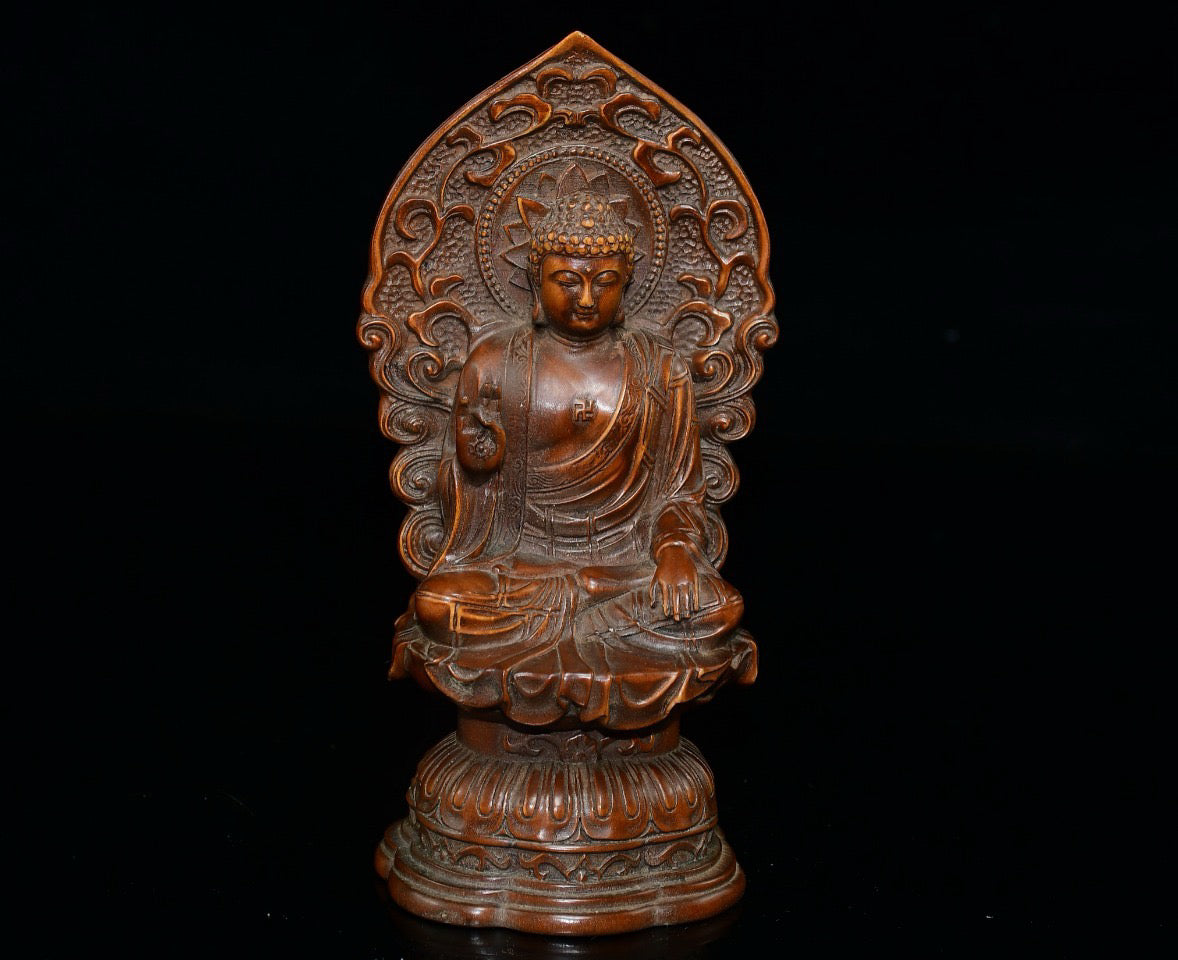 Small leaved boxwood with north facing Buddha ornaments