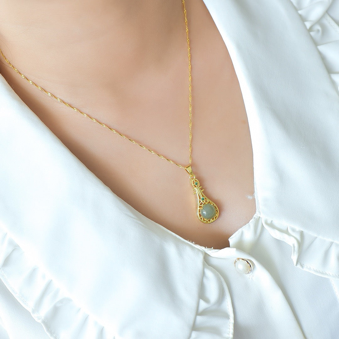 Copper inlaid Hotan Jade hollow pipa with green zirconium fashion pendant