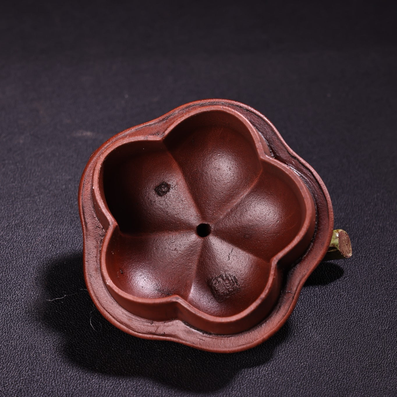 A red clay painted purple clay teapot