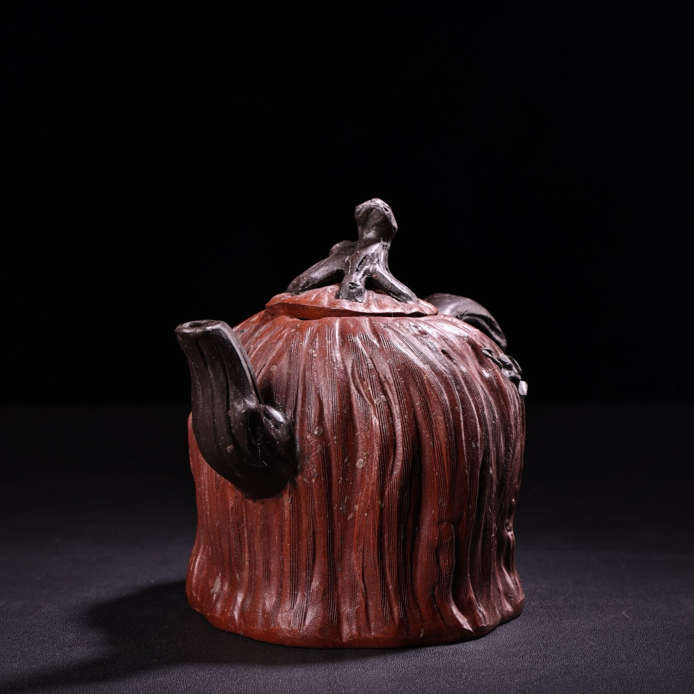 A red clay and purple clay teapot