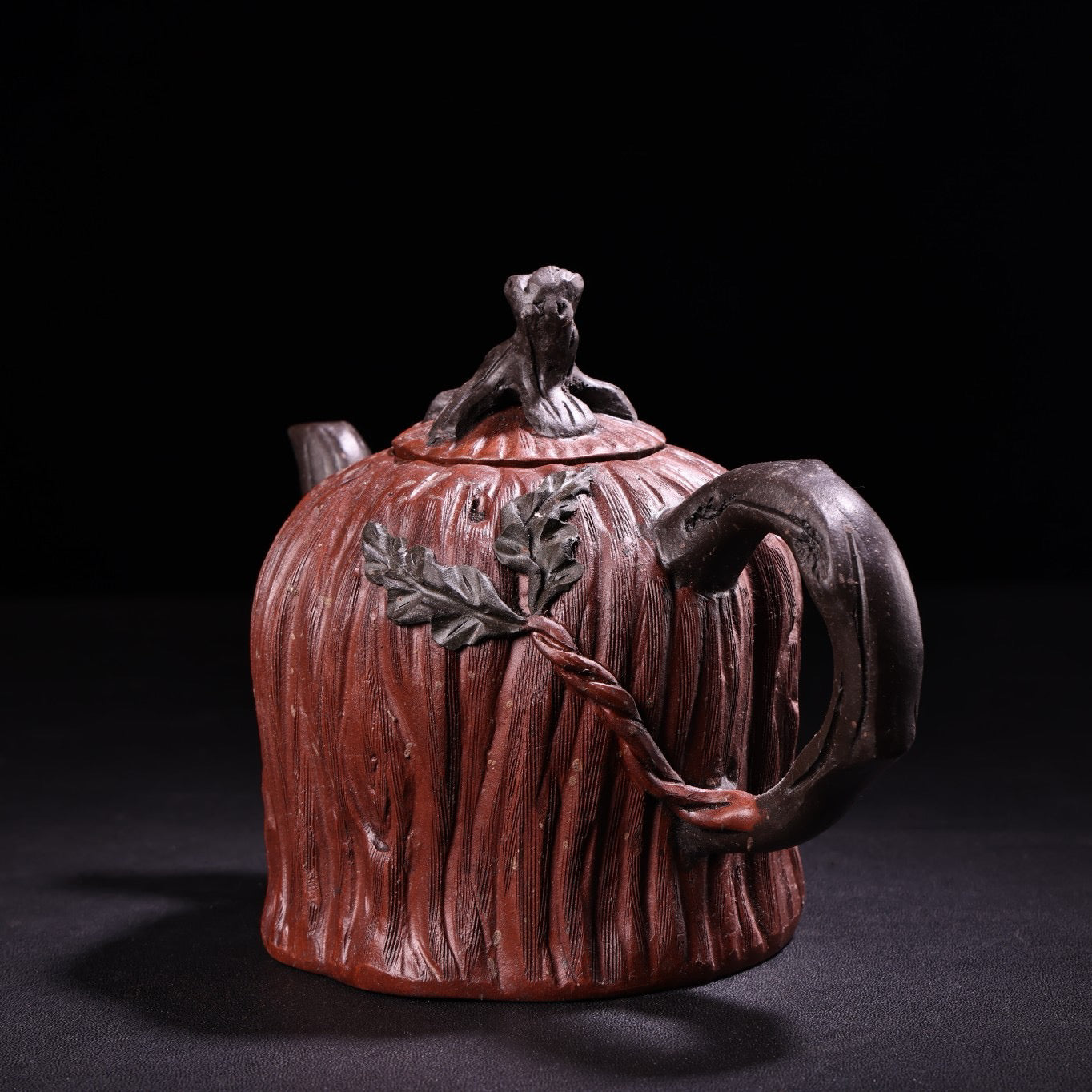A red clay and purple clay teapot
