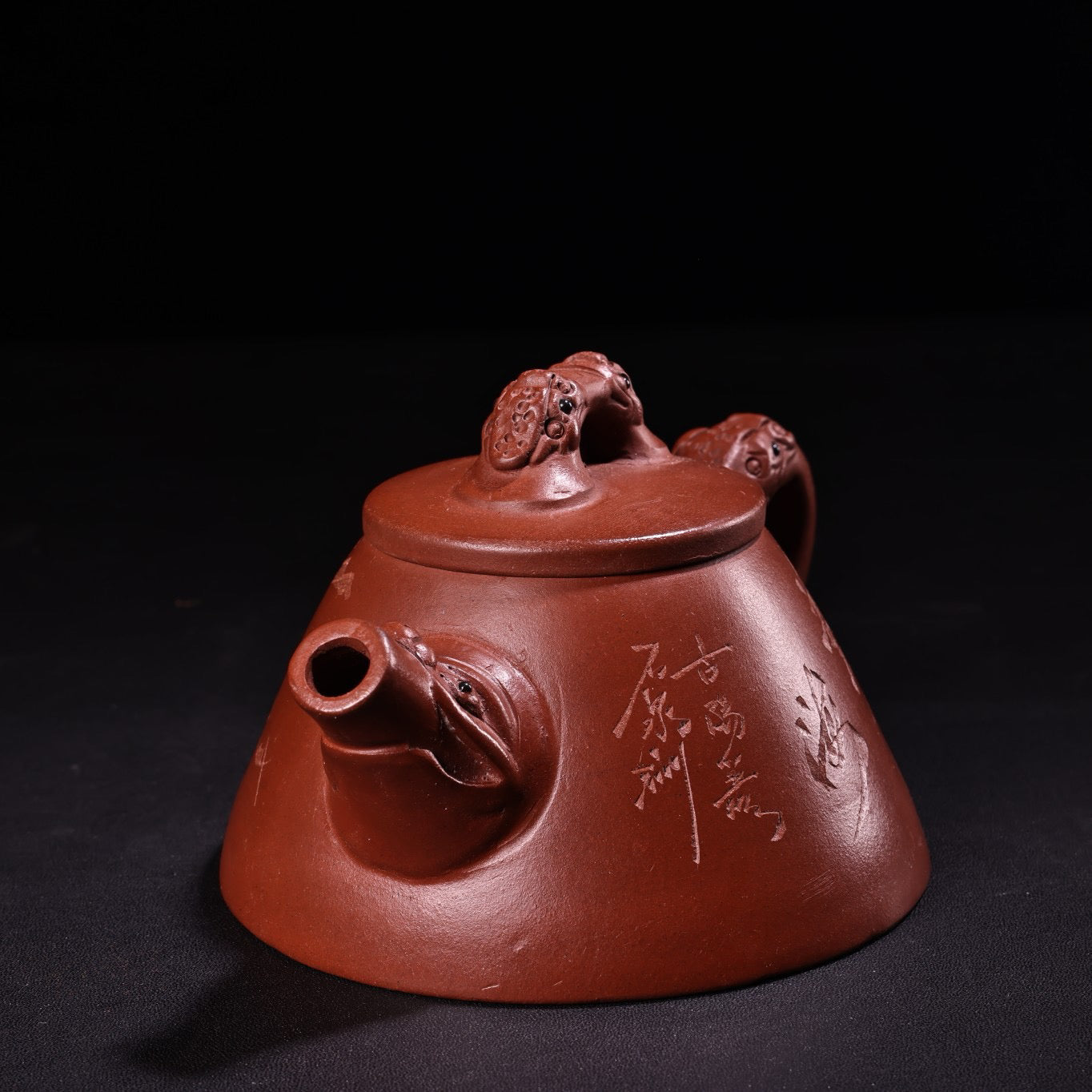 A red clay and purple clay teapot