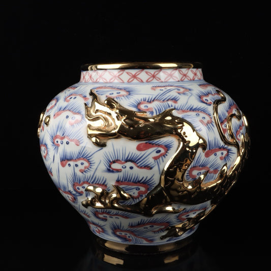 Blue and white glazed gilded golden red relief jar with cloud and dragon patterns