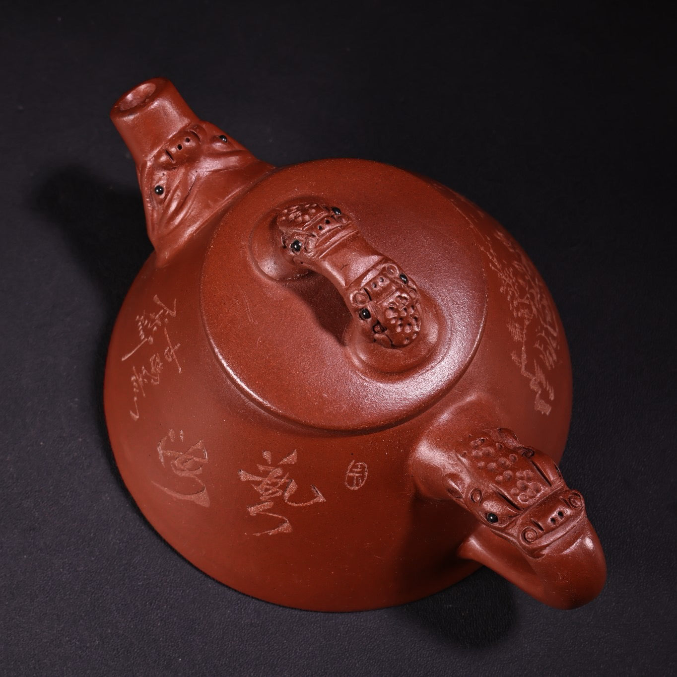 A red clay and purple clay teapot
