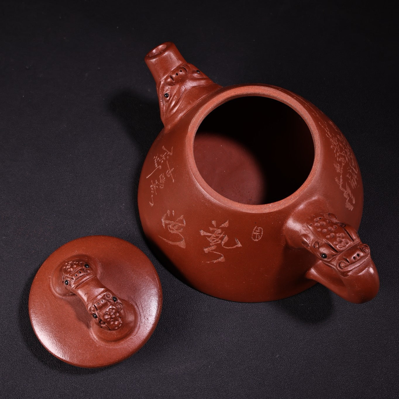 A red clay and purple clay teapot