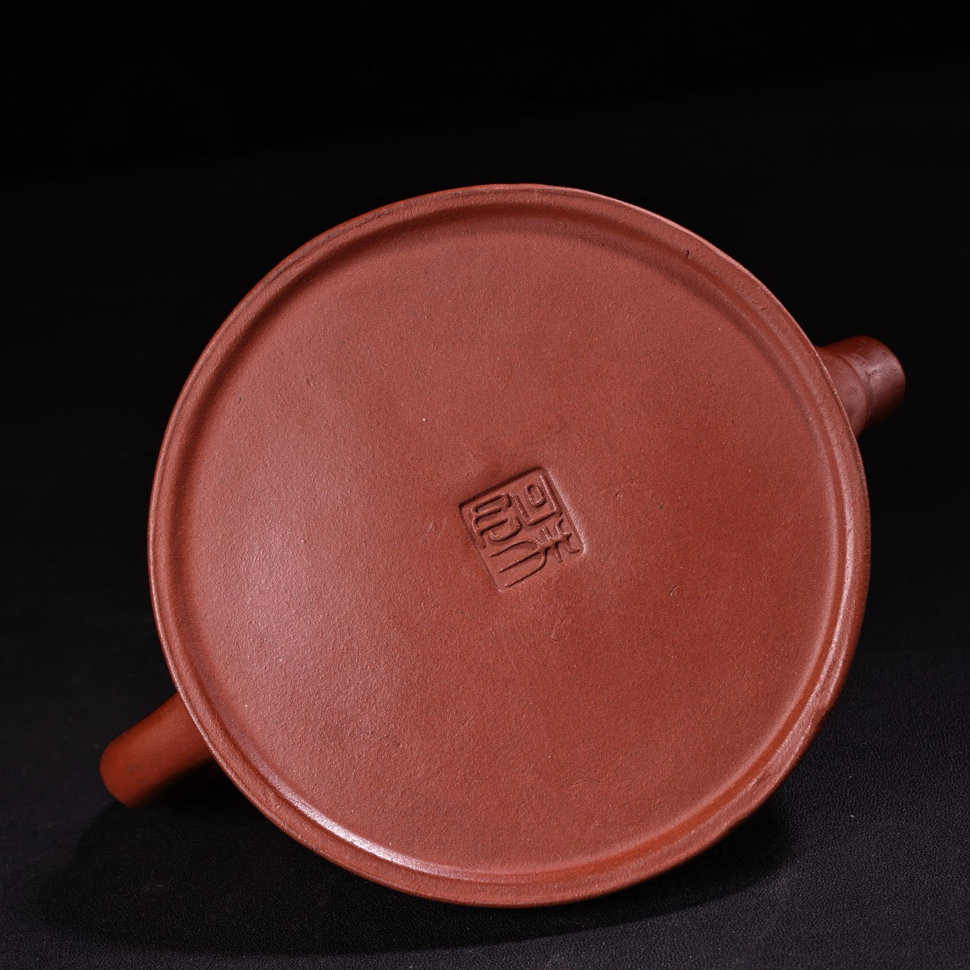 A red clay and purple clay teapot