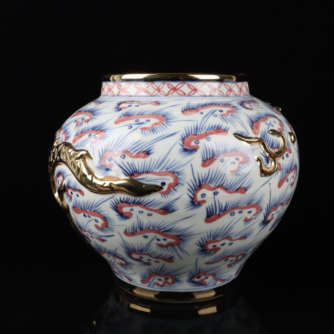 Blue and white glazed gilded golden red relief jar with cloud and dragon patterns