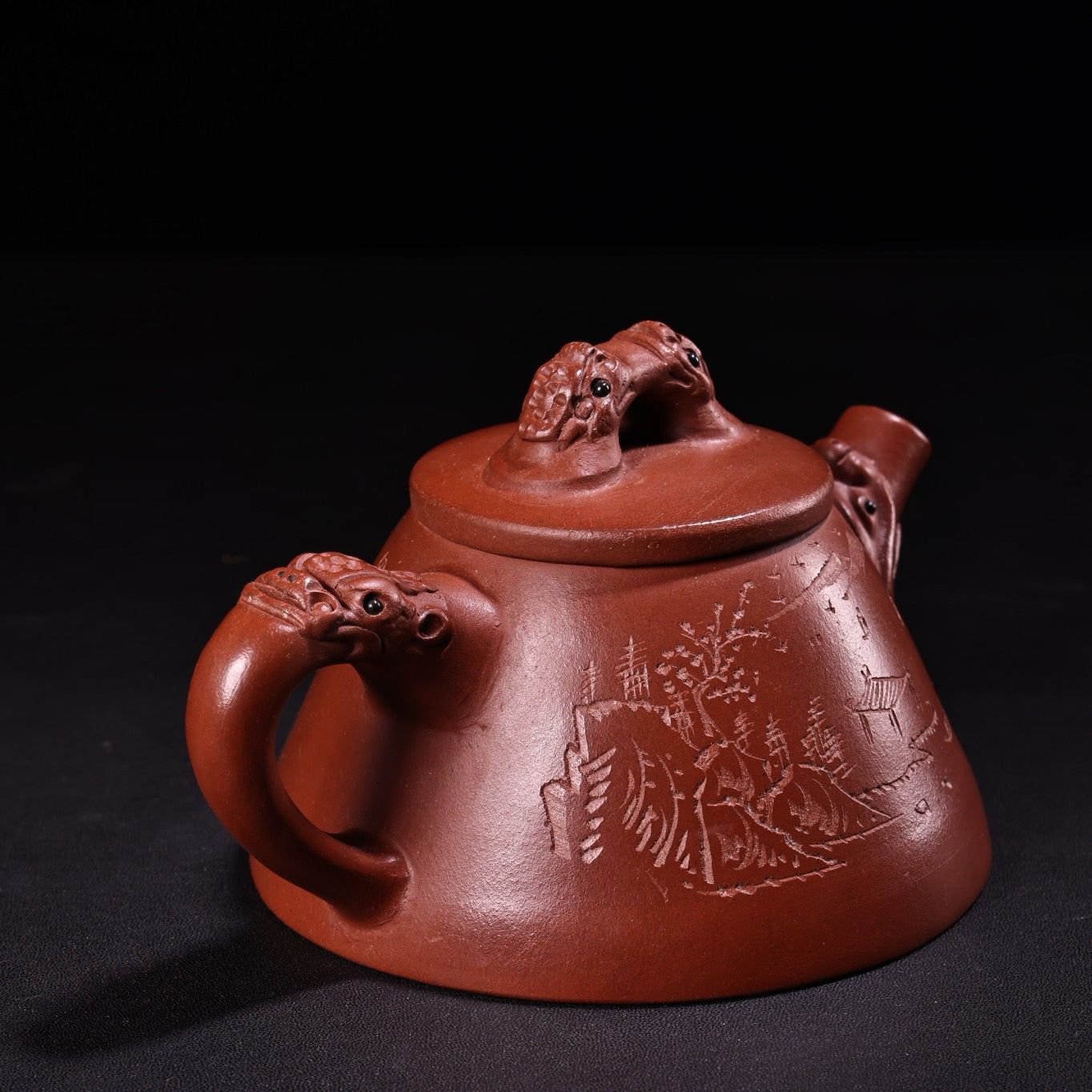A red clay and purple clay teapot