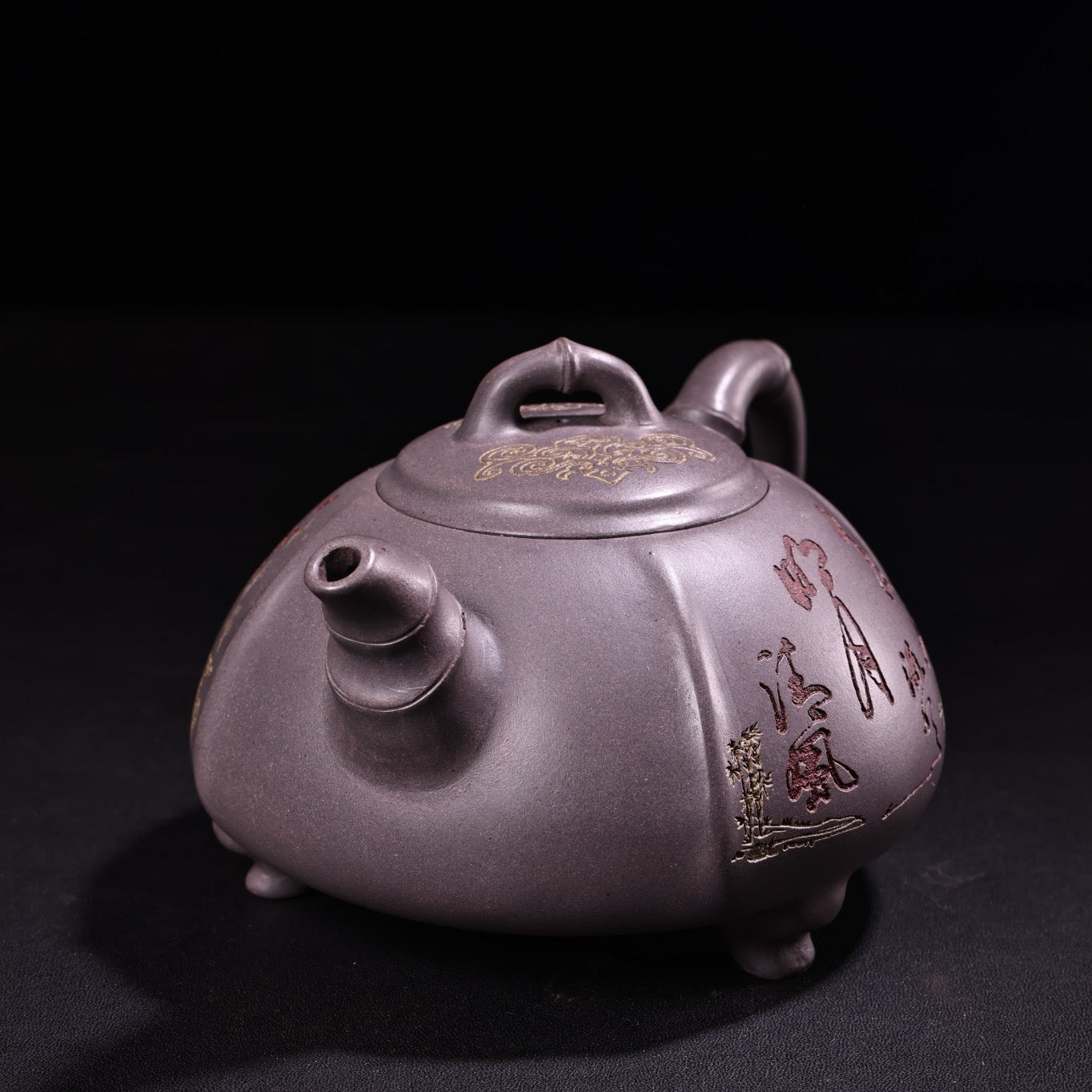 A handmade sky blue purple clay teapot