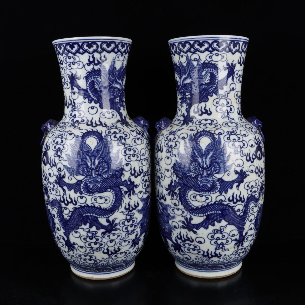 A pair of blue and white cloud dragon patterned beast ear bottles