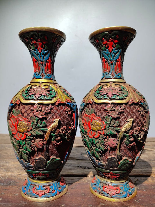 A pair of red lacquerware bottles