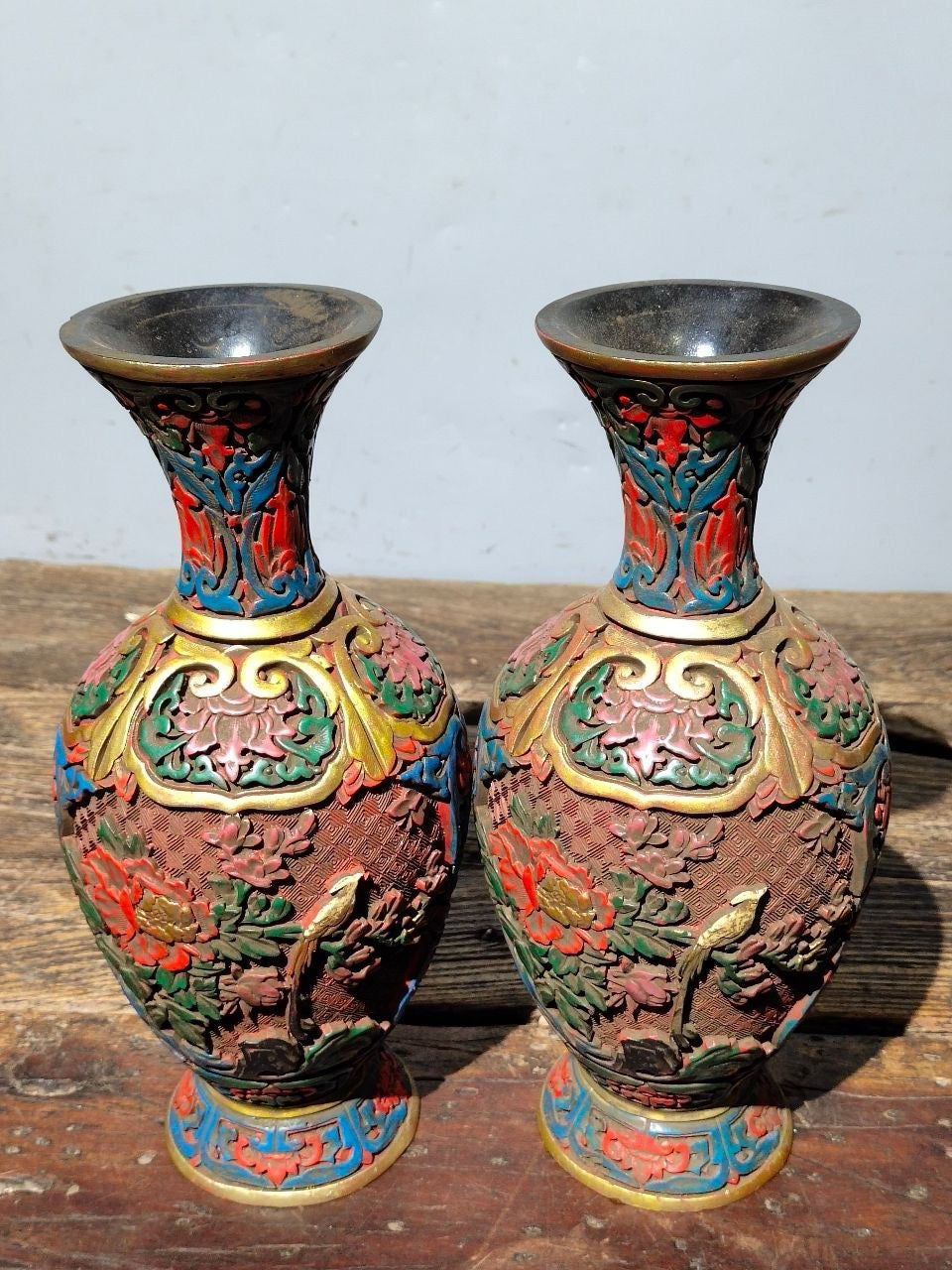 A pair of red lacquerware bottles