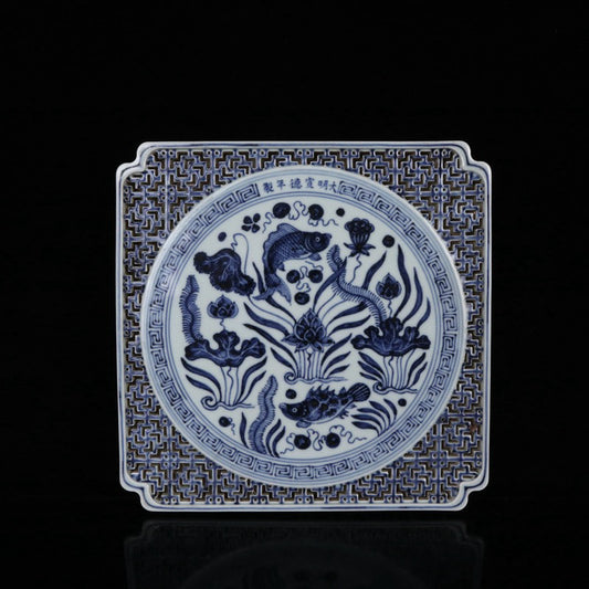 Blue and white square tea plate with fish and algae patterns