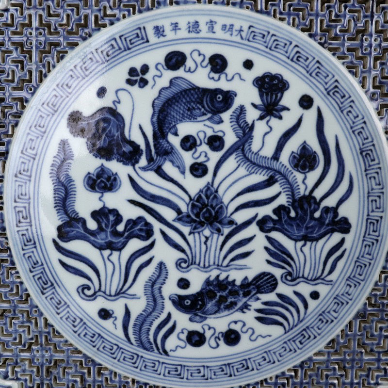 Blue and white square tea plate with fish and algae patterns