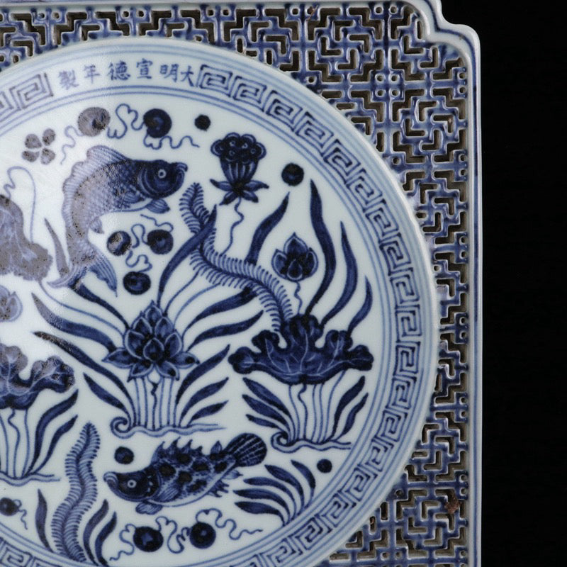 Blue and white square tea plate with fish and algae patterns