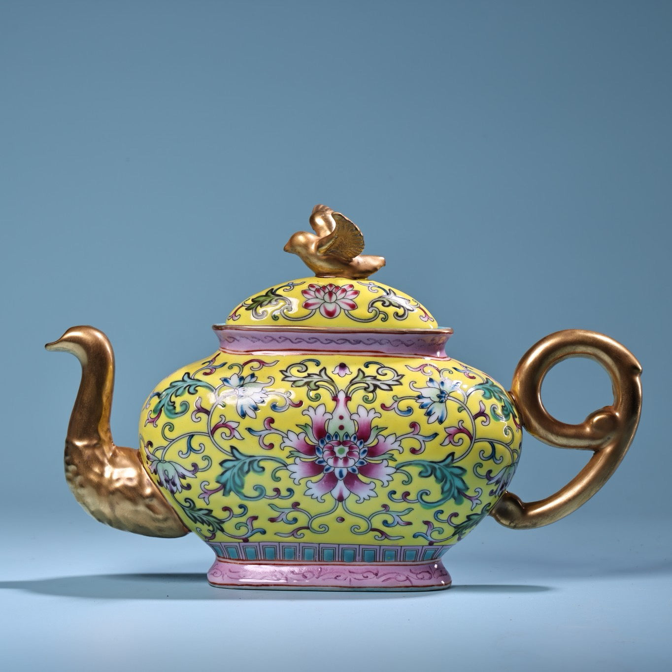 Hand painted enamel gilded gold colored porcelain teapot