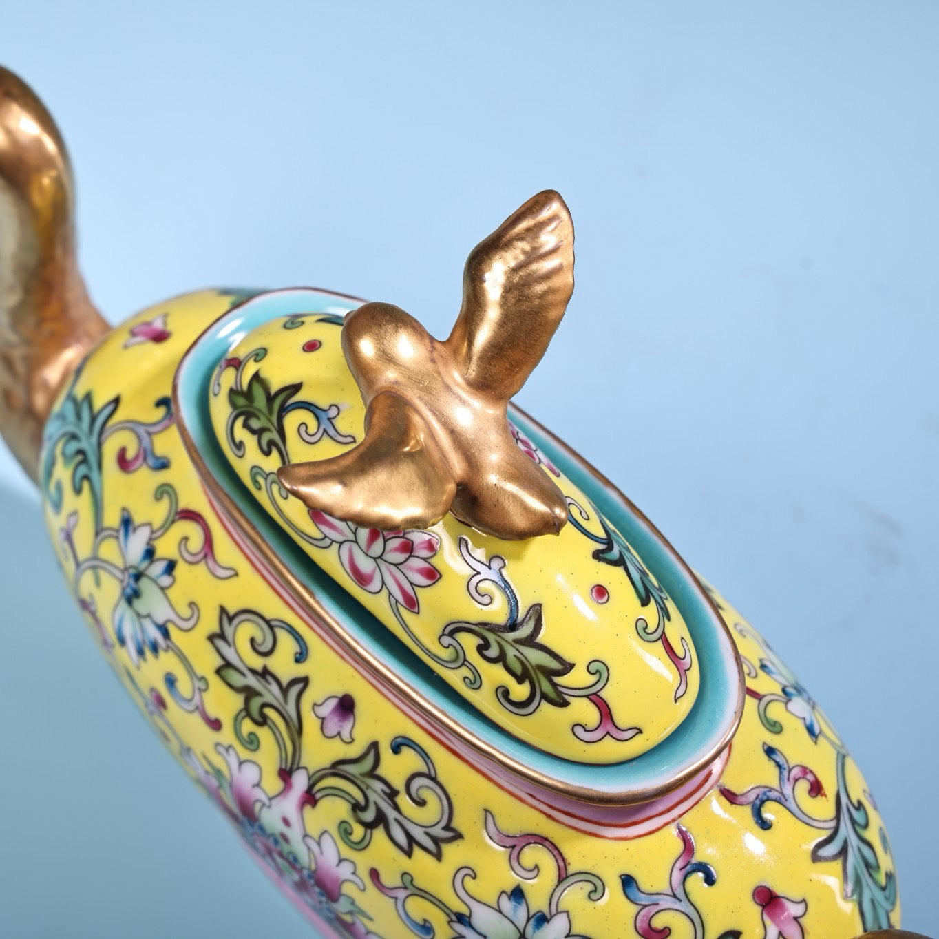 Hand painted enamel gilded gold colored porcelain teapot