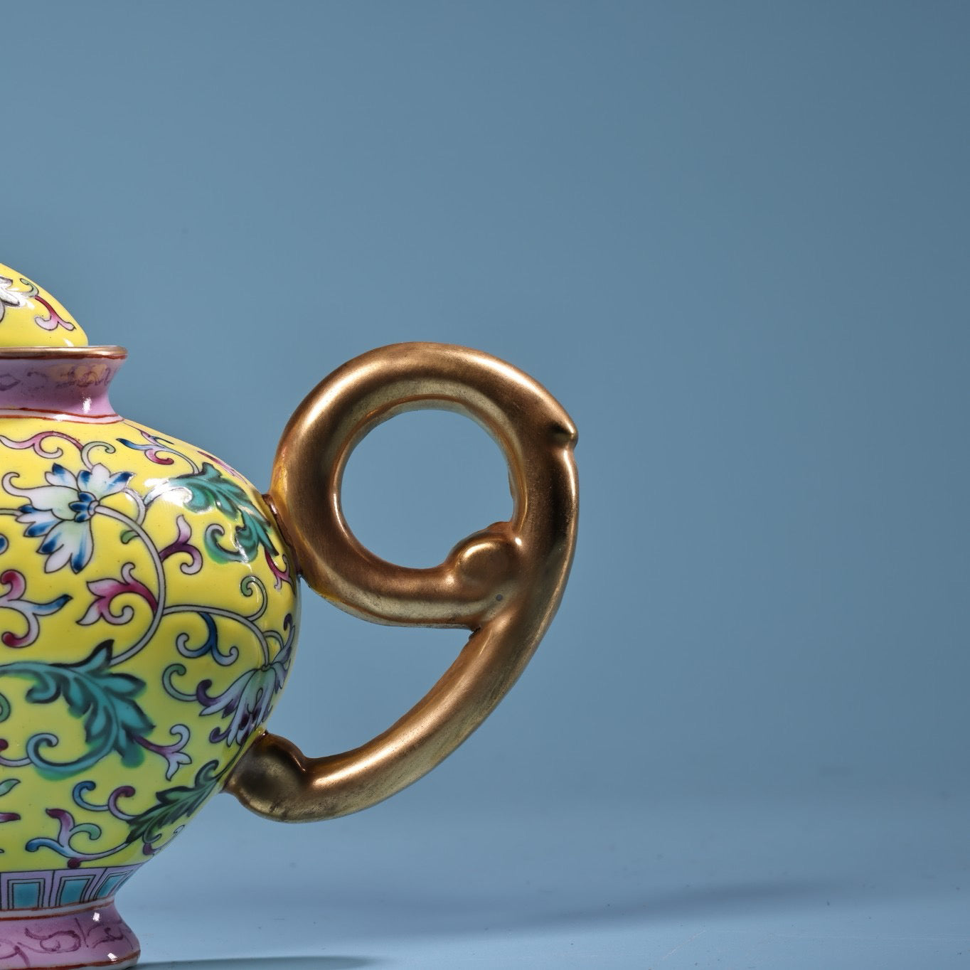 Hand painted enamel gilded gold colored porcelain teapot