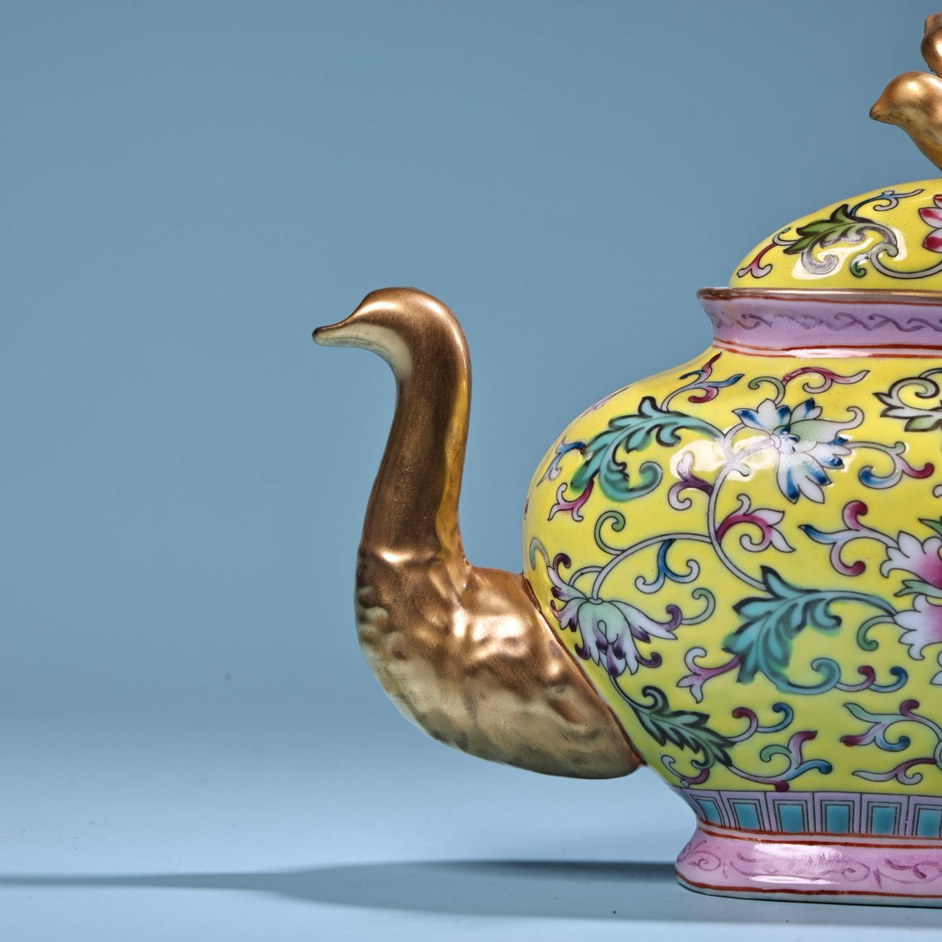 Hand painted enamel gilded gold colored porcelain teapot