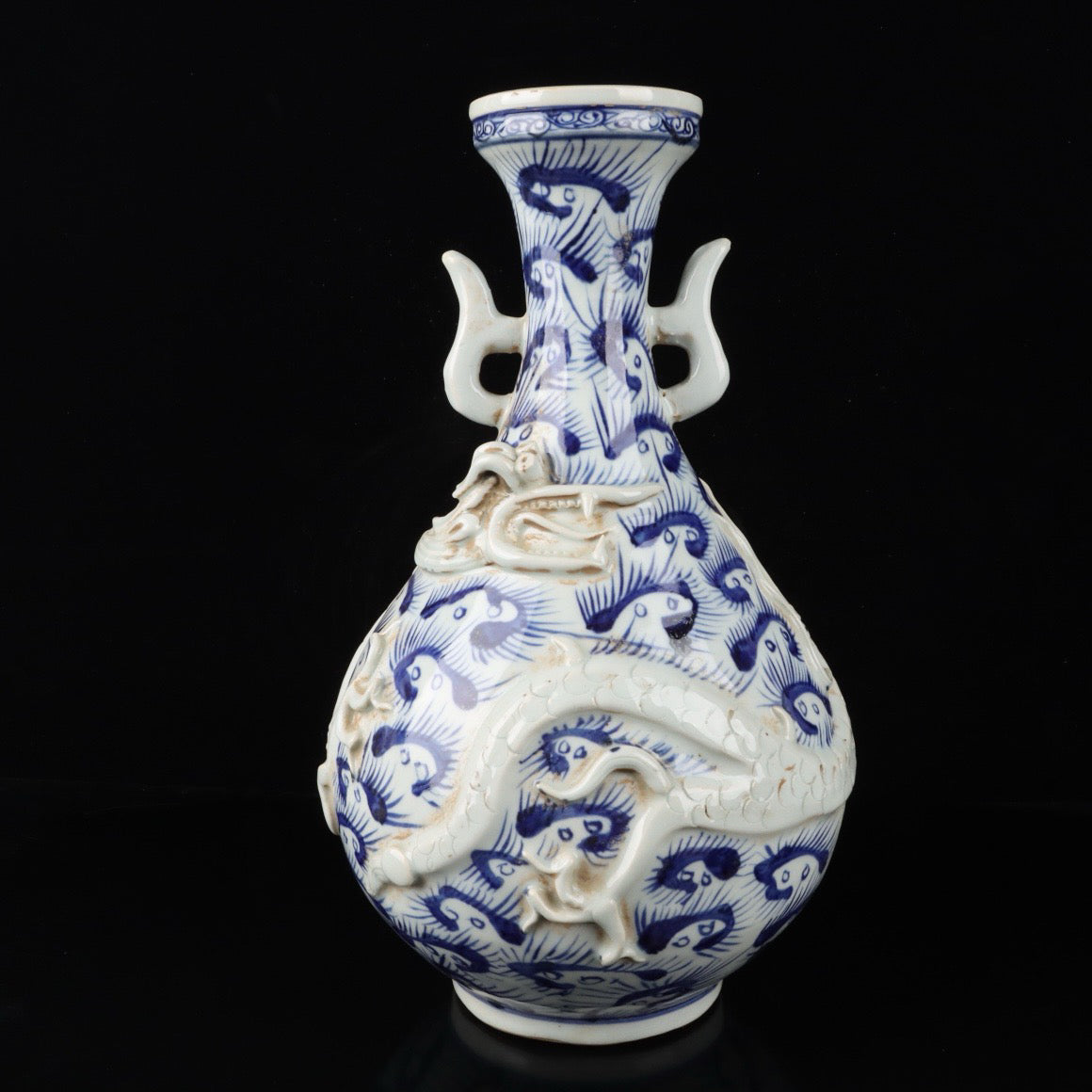 Blue and white relief cloud dragon patterned double ear vase