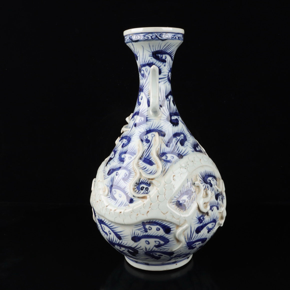 Blue and white relief cloud dragon patterned double ear vase