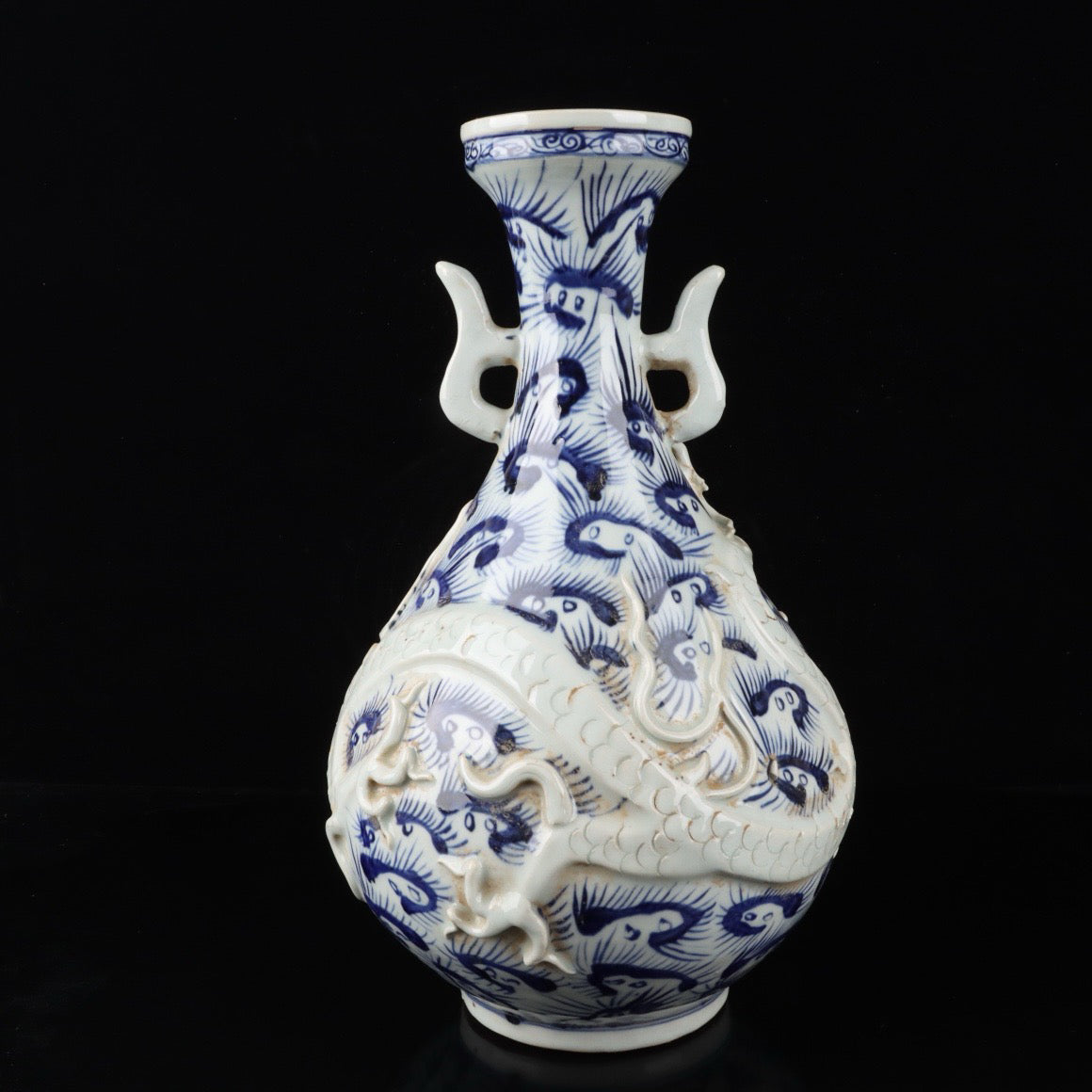 Blue and white relief cloud dragon patterned double ear vase