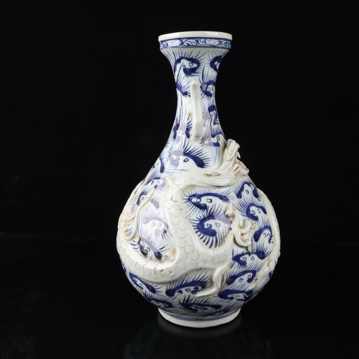 Blue and white relief cloud dragon patterned double ear vase