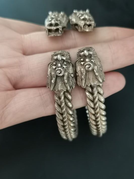 A pair of Chinese antique silver dragon head bracelets