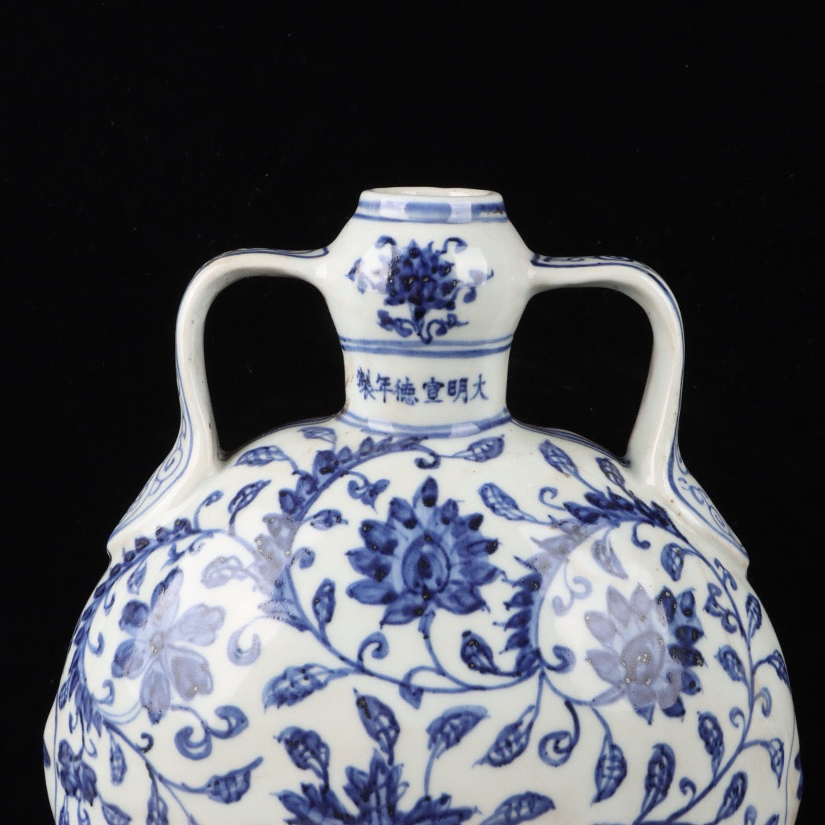 A pair of blue and white twisted branch lotus patterned double ear flat bottles