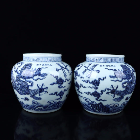 A pair of blue and white cloud dragon patterned jars