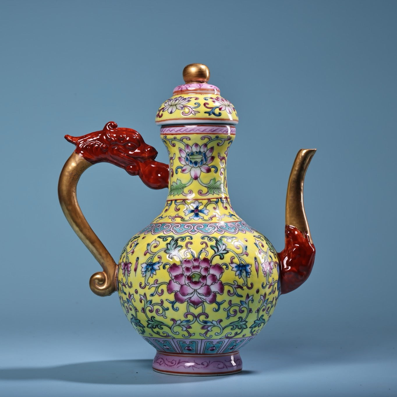 Hand painted enamel gilded gold colored porcelain teapot
