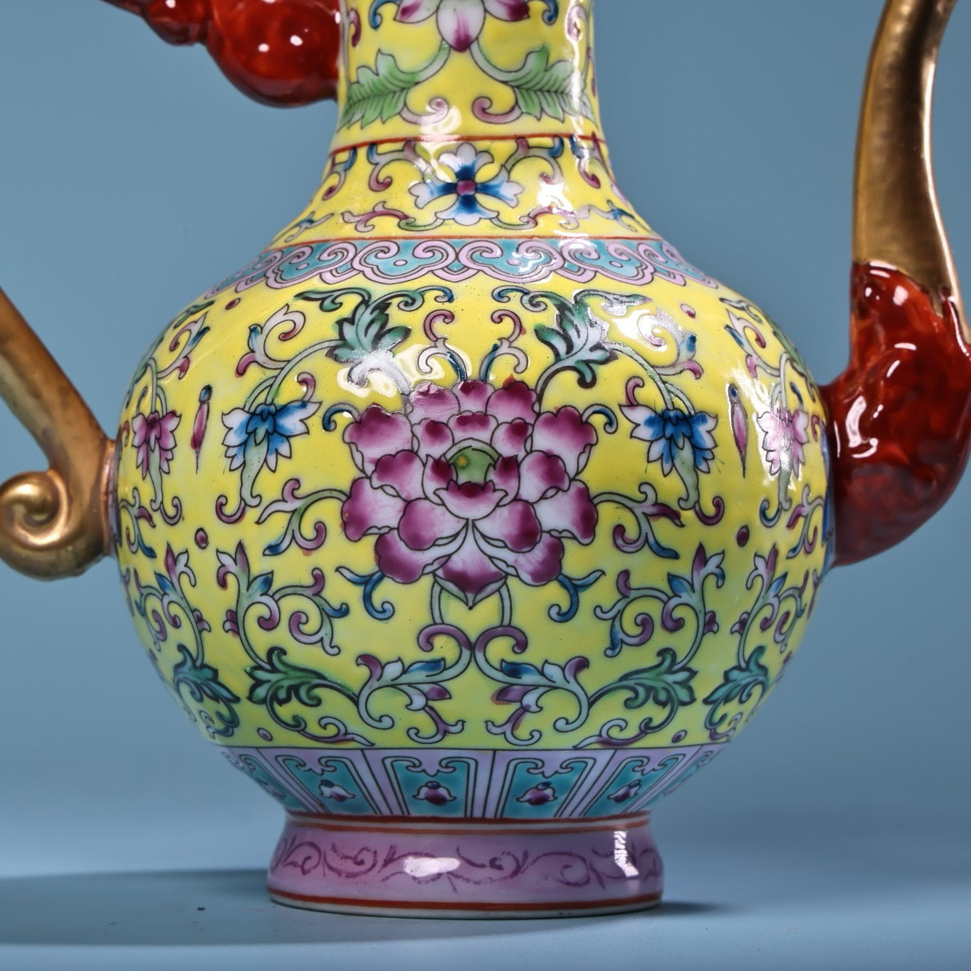 Hand painted enamel gilded gold colored porcelain teapot