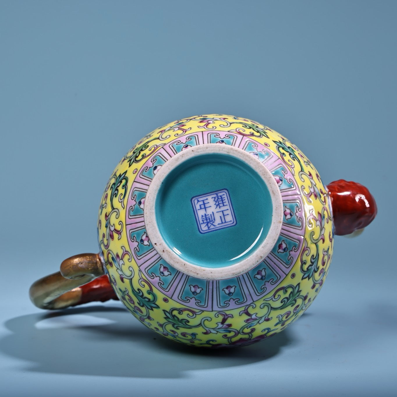 Hand painted enamel gilded gold colored porcelain teapot