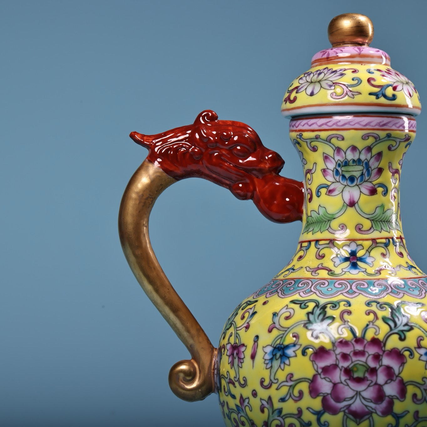 Hand painted enamel gilded gold colored porcelain teapot