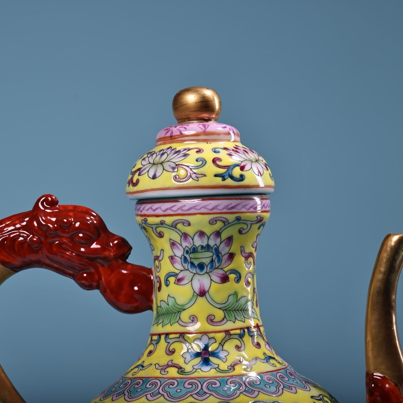 Hand painted enamel gilded gold colored porcelain teapot