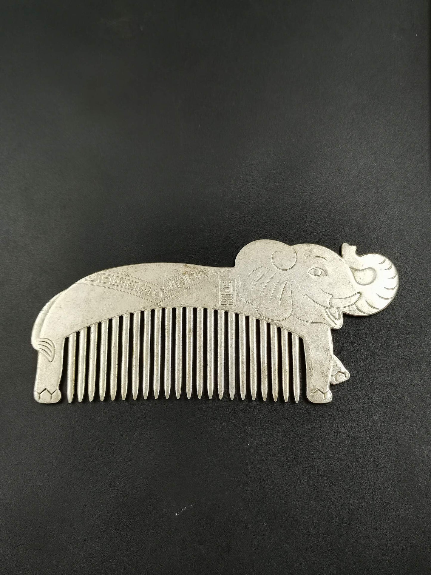 A Chinese antique silver comb