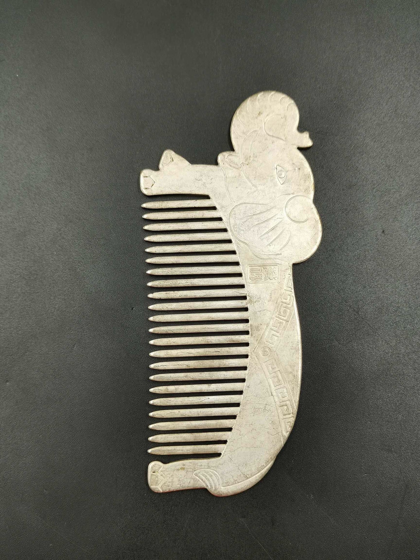 A Chinese antique silver comb