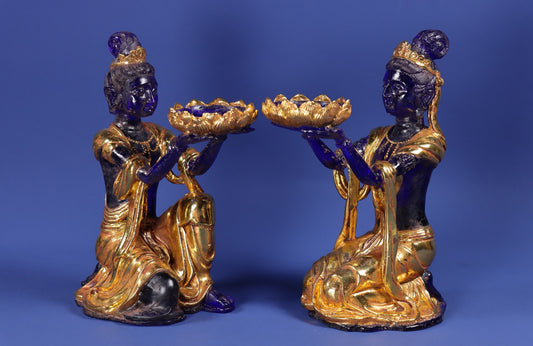 A pair of ancient Chinese glazed gold wrapped fairy candlestick ornaments