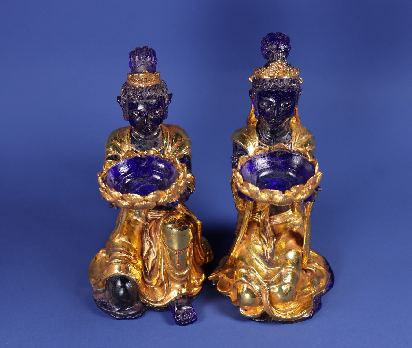 A pair of ancient Chinese glazed gold wrapped fairy candlestick ornaments