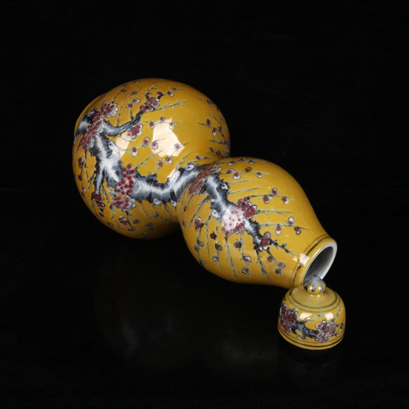 Blue and white glazed red plum blossom patterned gourd bottle with lid