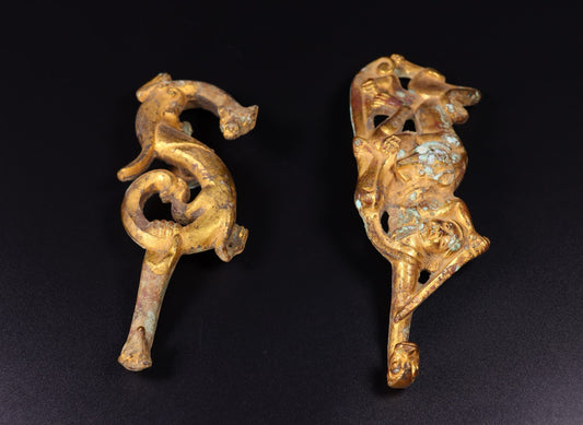 A pair of Chinese antique bronze gilded with red spots, green rust, and hooks