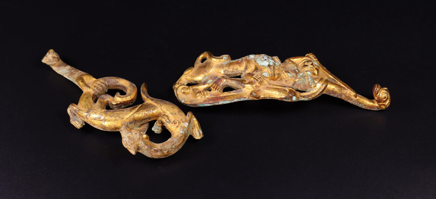 A pair of Chinese antique bronze gilded with red spots, green rust, and hooks