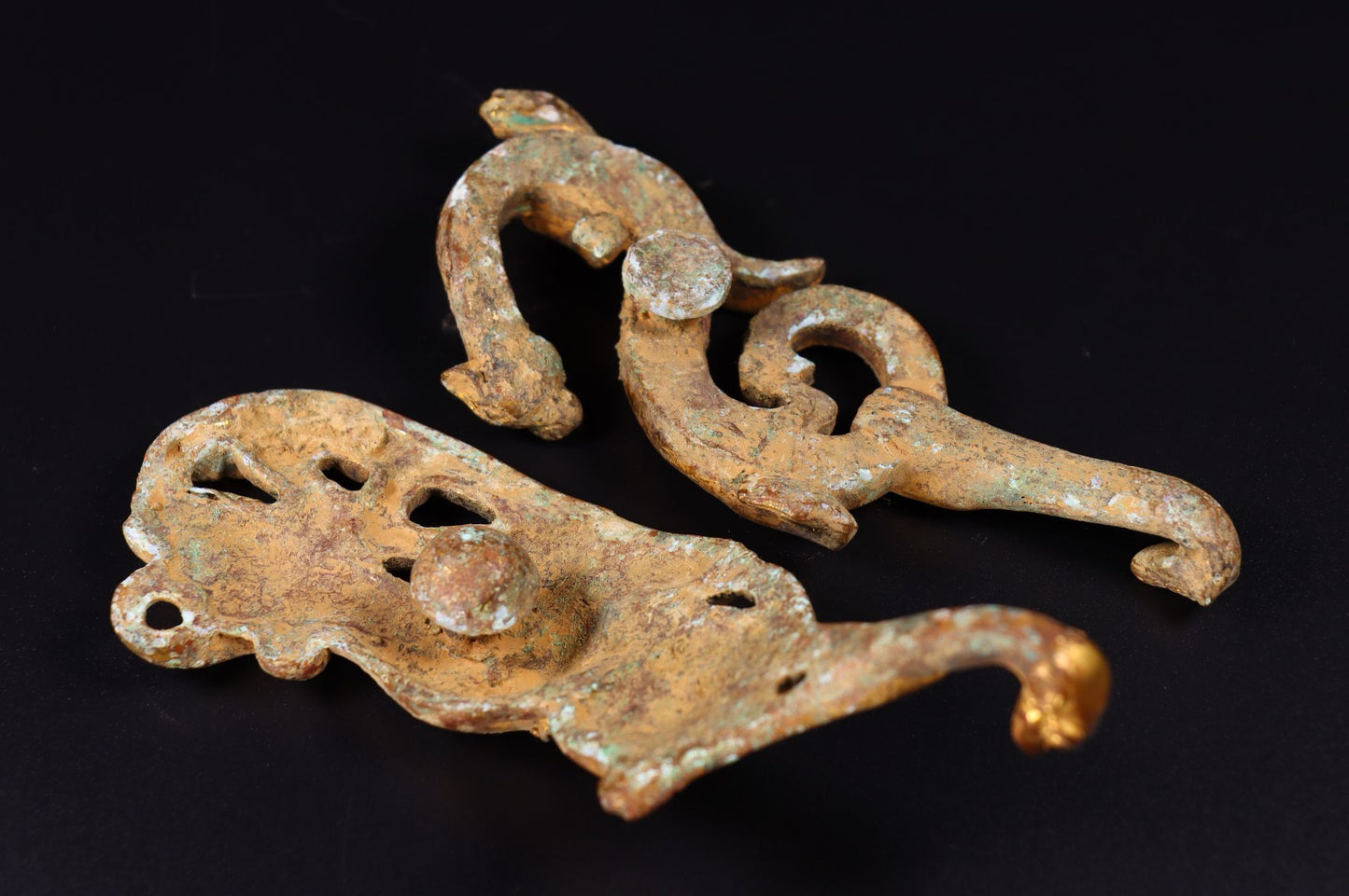 A pair of Chinese antique bronze gilded with red spots, green rust, and hooks