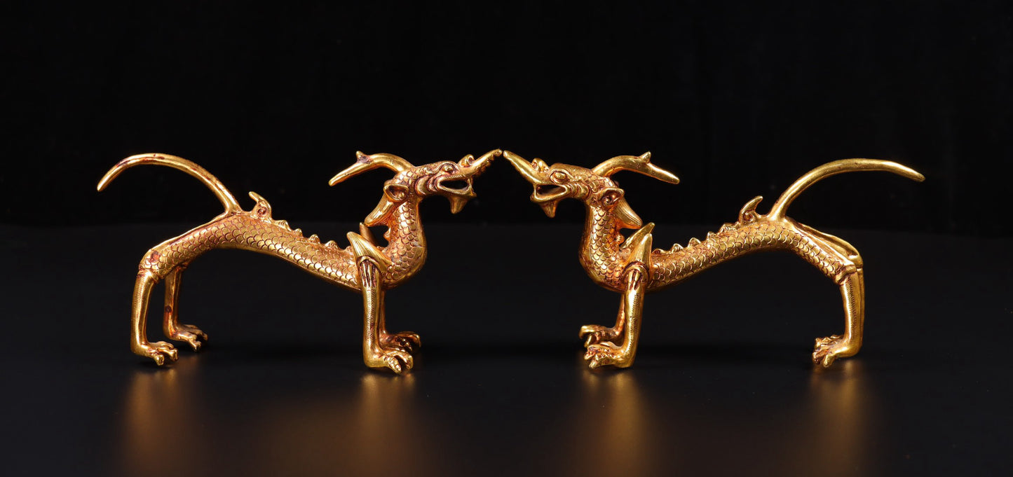 A pair of Chinese antique handmade copper gilded gold high relief carved dragons